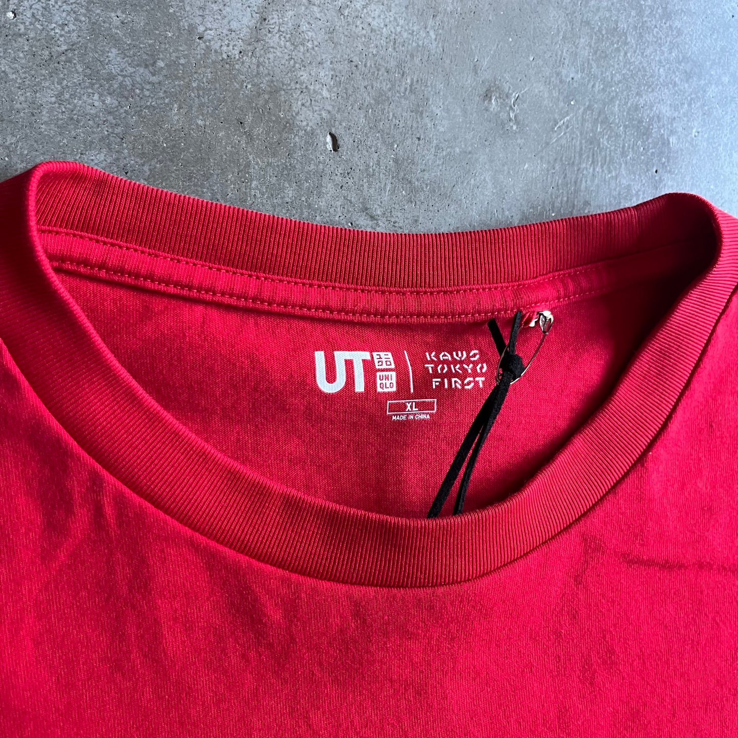 Kaws x Uniqlo “Kaws Tokyo First” Spell Out Tee