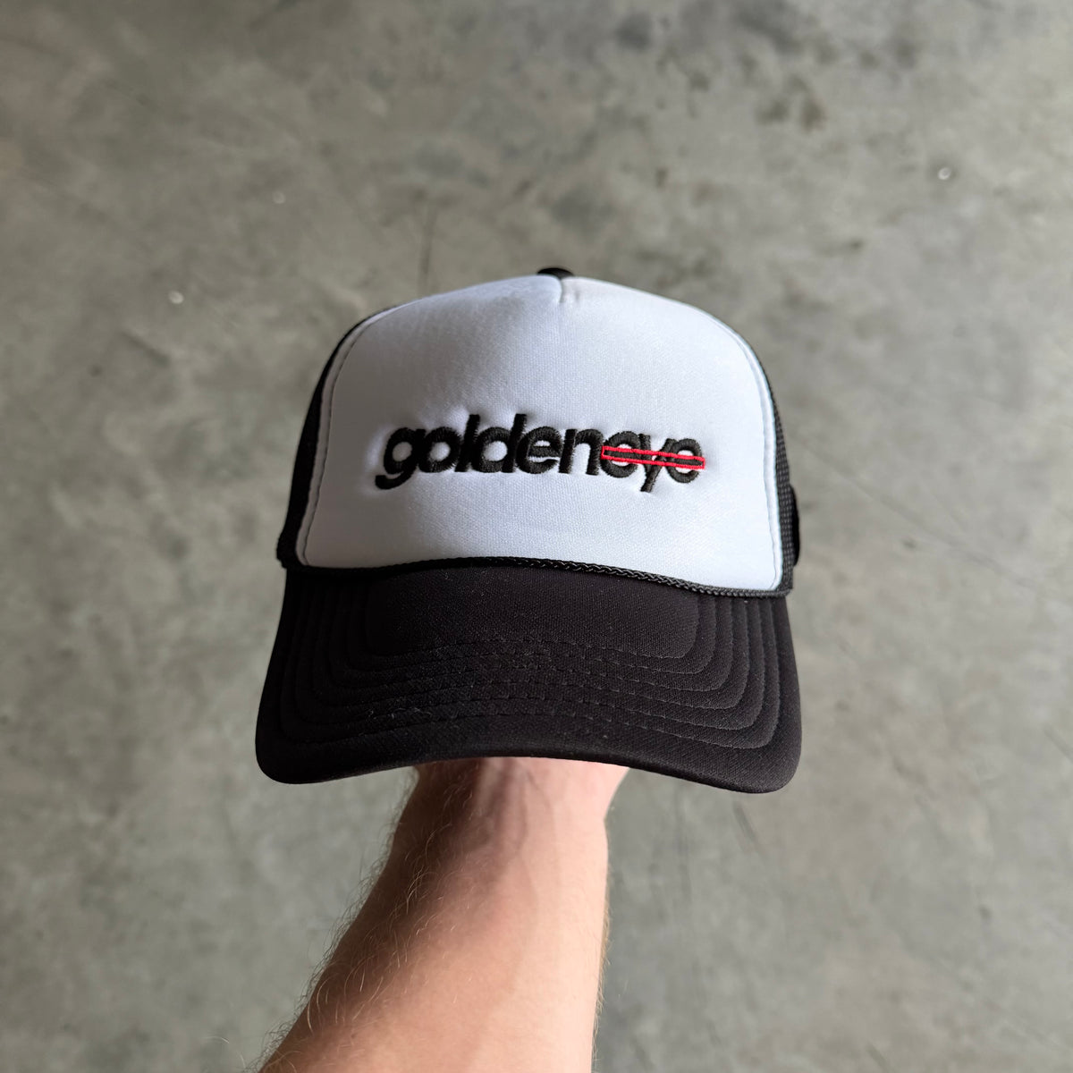 Goldeneye Spell-Out Logo Side Patch Trucker Hat