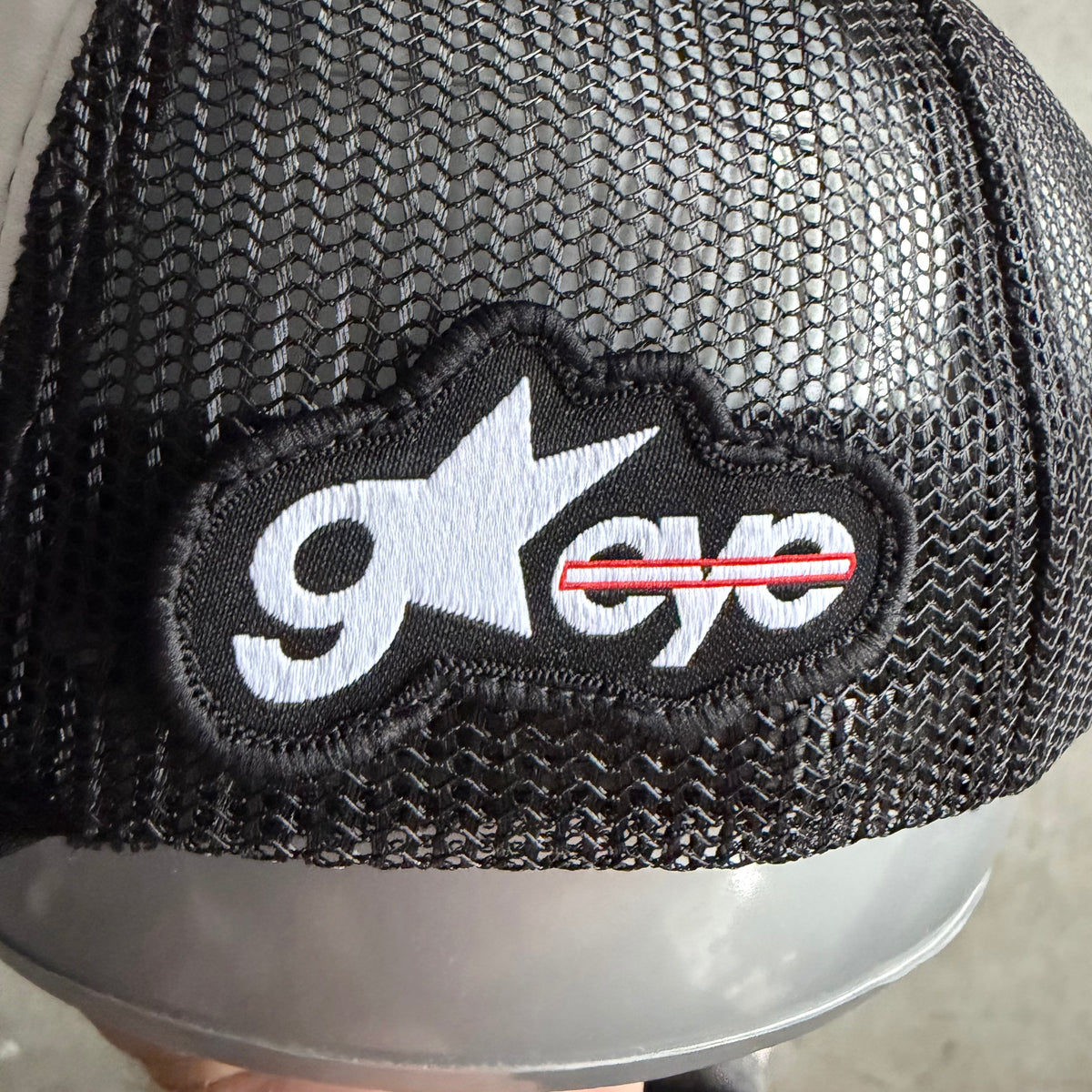 Goldeneye Spell-Out Logo Side Patch Trucker Hat